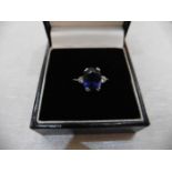 2.40ct sapphire and diamond ring. Oval cut ( glass filled ) sapphire with a small brilliant cut