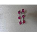 4.80ct ruby and diamond drop earrings set in 18ct gold. Each set with 3 oval cut rubies ( glass