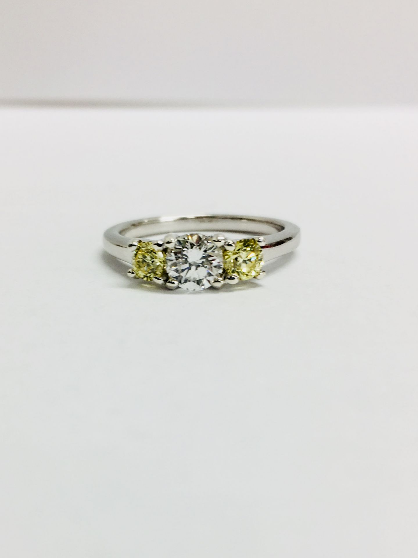 PLatinum diamond three stone ring,0.30ct centre h colour si3 brilliantcut diamond.two 0.10ct 3mm