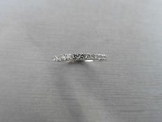 0.32ct diamond band ring set in 9ct white gold. Small brilliant cut diamonds, I colour and i1