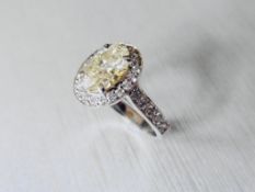 2.01ct fancy yellow oval diamond,si clarity very good cut,platinum handmade string 5.gms,diamond set