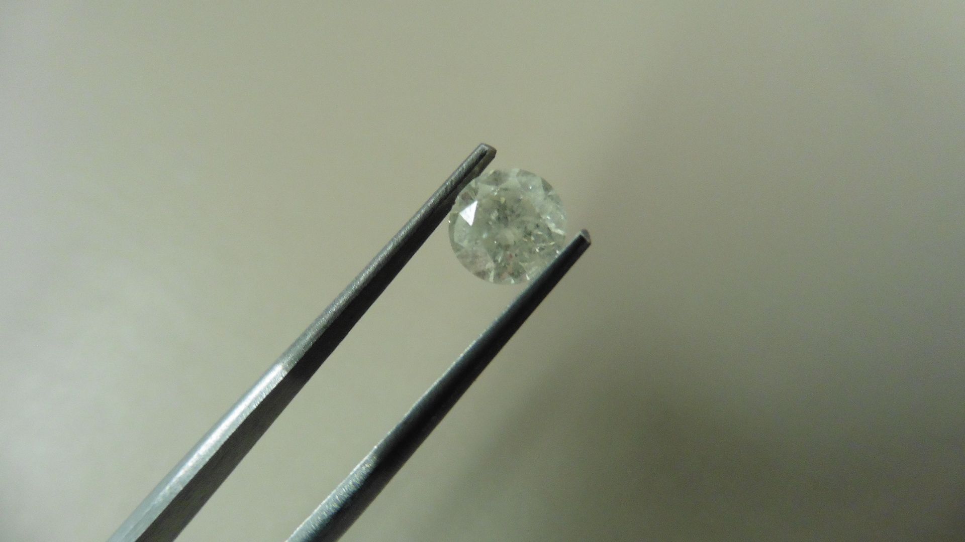 1.04ct Brilliant Cut Diamond, Enhanced stone. H colour, I1 clarity. . Valued at £1490