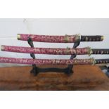 Set Of Ornamental Decorative Swords On Display Stand