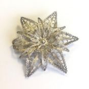 A stunning antique silver filigree flower brooch - marked 925