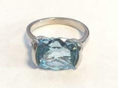 Blue Topaz and diamond, platinum over sterling silver ring