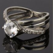 A CUBIC ZIRCONIA SOLITAIRE RING (NO HALLMARKS - STAMPED 375)