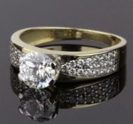 SOLITAIRE RING, COMPRISING A RAISED CIRCULAR SHAPE