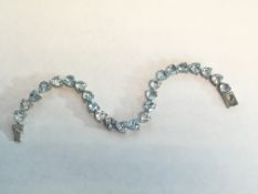 Beautiful Platinum over Sterling Silver and Blue Topaz Tennis Bracelet