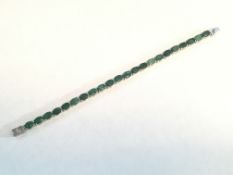 Beautiful Platinum over Sterling Silver and Emerald Tennis Bracelet