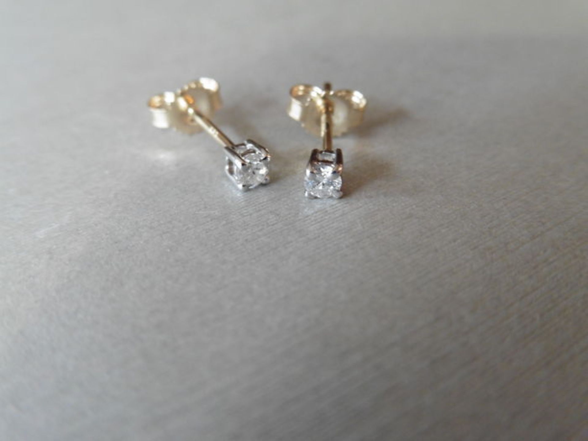 0.10ct Solitaire diamond stud earrings set with brilliant cut diamonds, SI2 clarity and I colour.