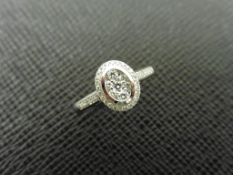 0.33ct diamond set solitaire style ring. Oval setting with small round cut diamonds, H colour and I1