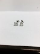 0.90ct Solitaire diamond stud earrings set with brilliant cut diamonds. I1 clarity and I colour. Set