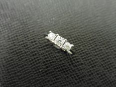 0.15ct trilogy style diamond ring set in 9ct white gold. Illusion setting with 3 small round cut