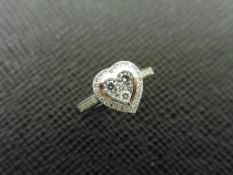 0.33ct diamond set solitaire style ring. Heart shaped with small round cut diamonds, H colour and I1