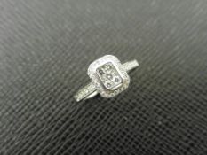 0.33ct diamond set solitaire style ring. rectangular setting with small round cut diamonds, H colour