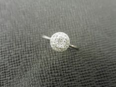 0.24ct diamond illusion set cluster ring in 9ct white gold. Brilliant cut diamonds, H colour and