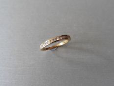 0.15ct diamond eternity ring set in 9ct yellow gold. Channel setting, H,I colour, Si2 clarity.
