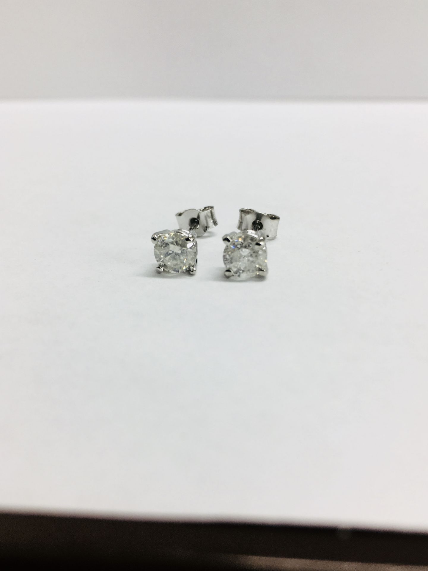 1.00ct Solitaire diamond stud earrings set with brilliant cut diamonds, i1 clarity and I colour. Set