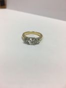 1.15ct Diamond three stone ring,070ct centre,0.30ct outer total ,4.5gms 18ct yellow/white mount .