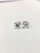 1.40ct brilliant cut natural diamond(2x0.70ct),i colour si1 clarity,(clarity enhanced),2gms 18ct