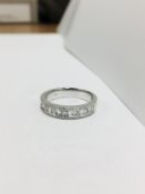 18ct white gold dress ring,0.50ct round and baguette diamond,h colour vs clarity,4.08gms 18ct