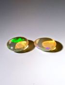 An unusual Pair IGL&I certified 3.00 Cts natural Multi Colour Ethiopian Opals.