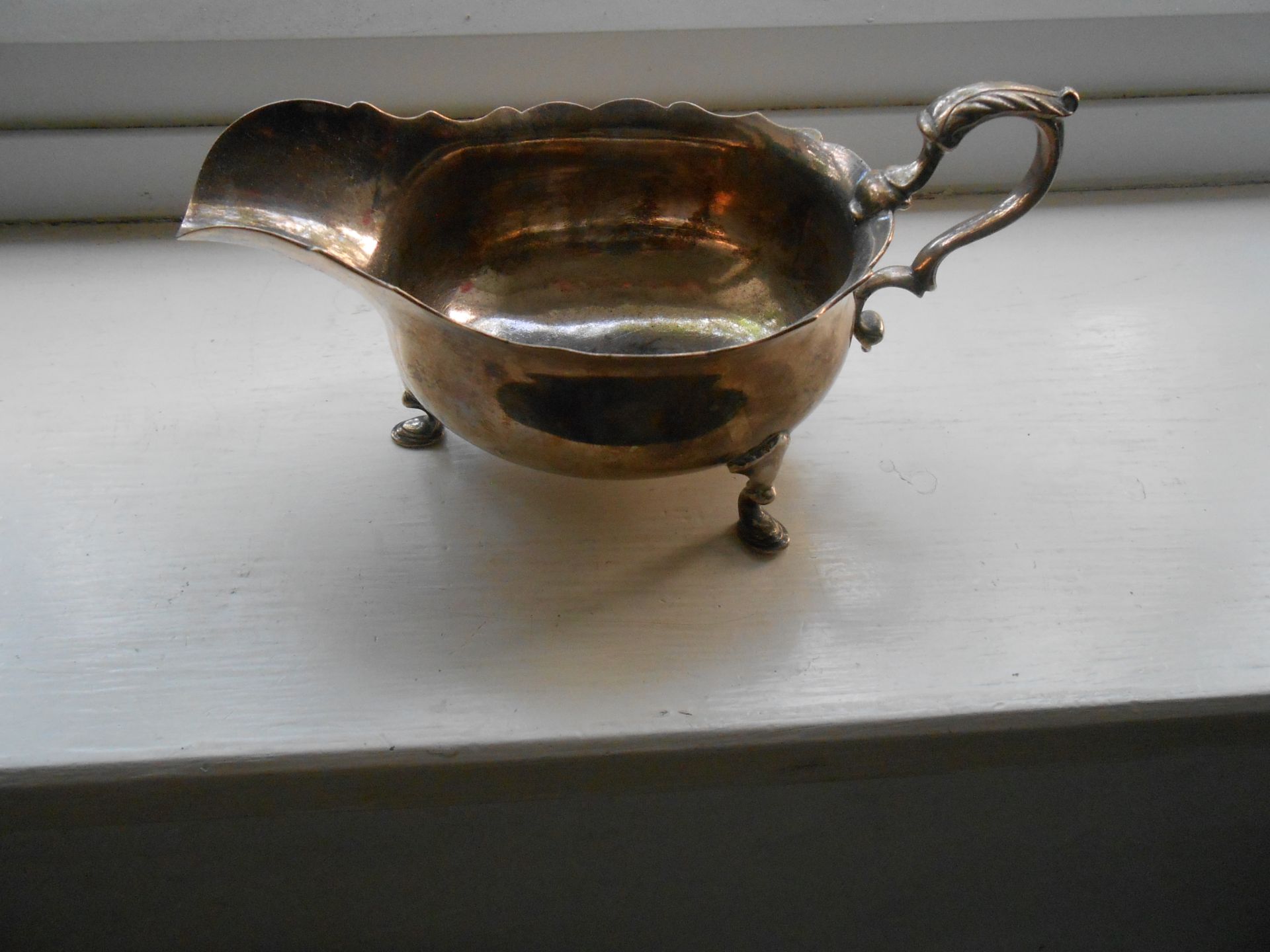 A hallmarked solid Silver George III sauce boat on three feet - Image 3 of 6