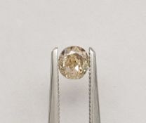 An unmounted Cushion-shaped diamond weighing app. 0.71ct. Colour : Brown .Clarity :SI1