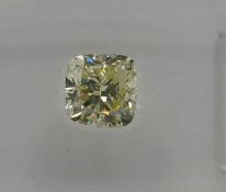 An unmounted Cushion-shaped diamond weighing app. 0.9ct. Colour : Yellow .Clarity :SI1