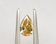 An unmounted Pear-shaped diamond weighing app. 0.58ct. Colour : Brown .Clarity :SI1