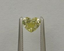 An unmounted Heart-shaped diamond weighing app. 0.51ct. Colour : Yellow .Clarity :SI2