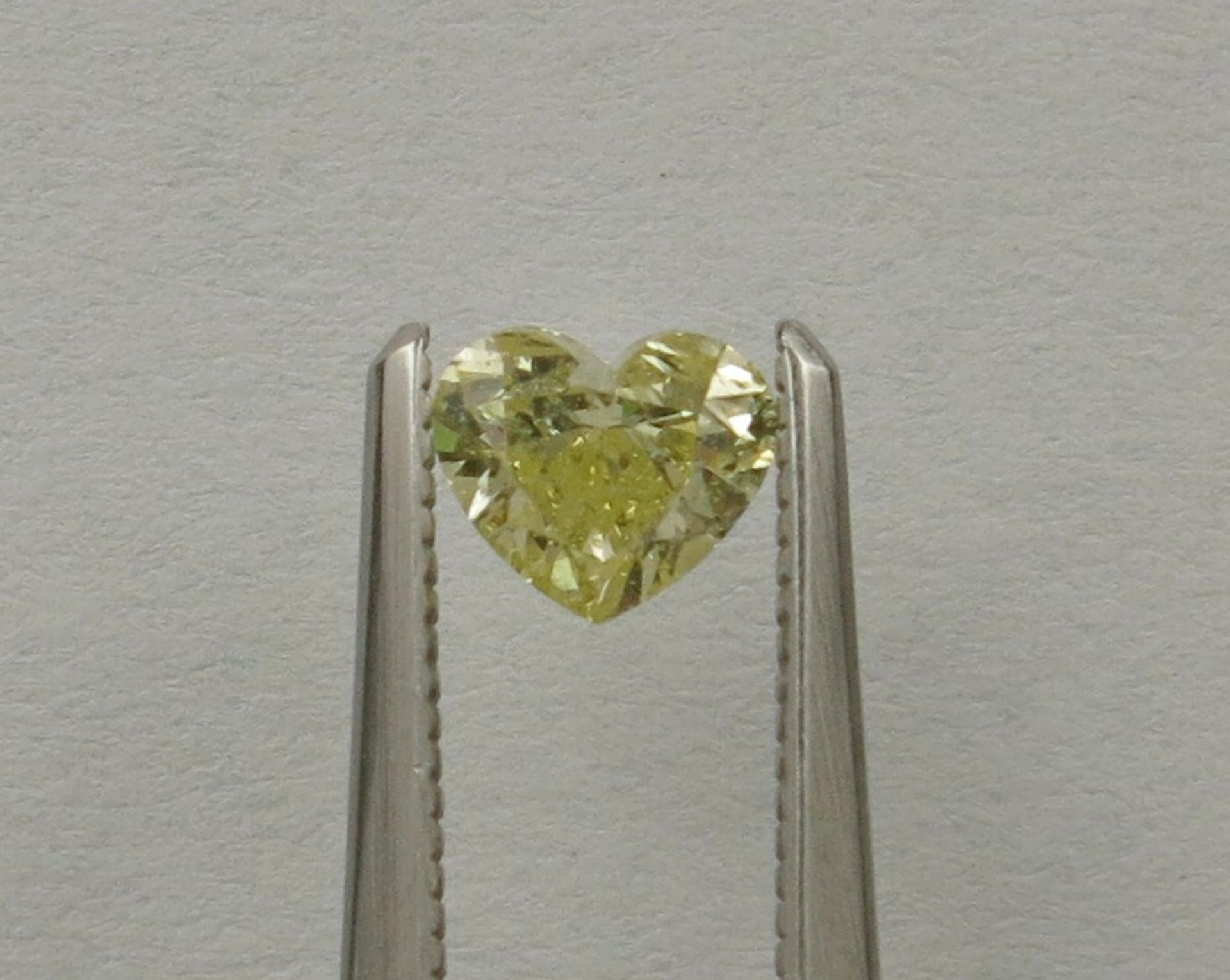 An unmounted Heart-shaped diamond weighing app. 0.51ct. Colour : Yellow .Clarity :SI2