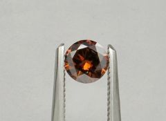An unmounted Round-shaped diamond weighing app. 0.44ct. Colour : Brown .Clarity :SI1