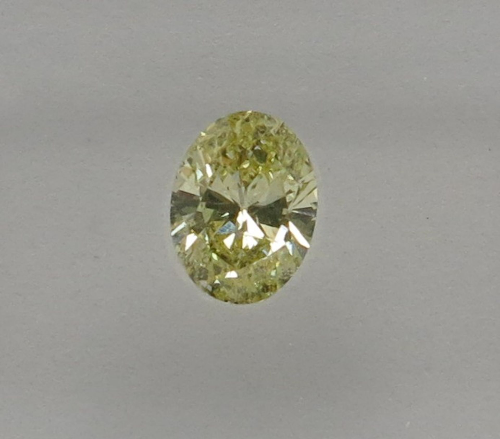 An unmounted Oval-shaped diamond weighing app. 0.51ct. Colour : Yellow .Clarity :I1