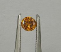 An unmounted Round-shaped diamond weighing app. 0.28ct. Colour : Yellow .Clarity :SI2