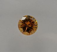 An unmounted Round-shaped diamond weighing app. 0.32ct. Colour : Yellow .Clarity :SI1
