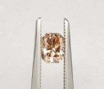 An unmounted Radiant-shaped diamond weighing app. 0.65ct. Colour : Brown .Clarity :SI2