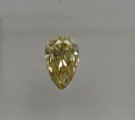 An unmounted Pear-shaped diamond weighing app. 0.52ct. Colour : Yellow .Clarity :VVS2