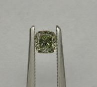 An unmounted Cushion-shaped diamond weighing app. 0.56ct. Colour : Yellow .Clarity :VS2