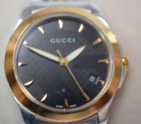 Lady's Gucci G-Timeless watch.