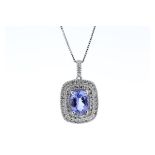 Certified by GIE 14ct White Gold Oval Tanzanite And Diamond Cluster Pendant 0.28 Carats, Colour-D,