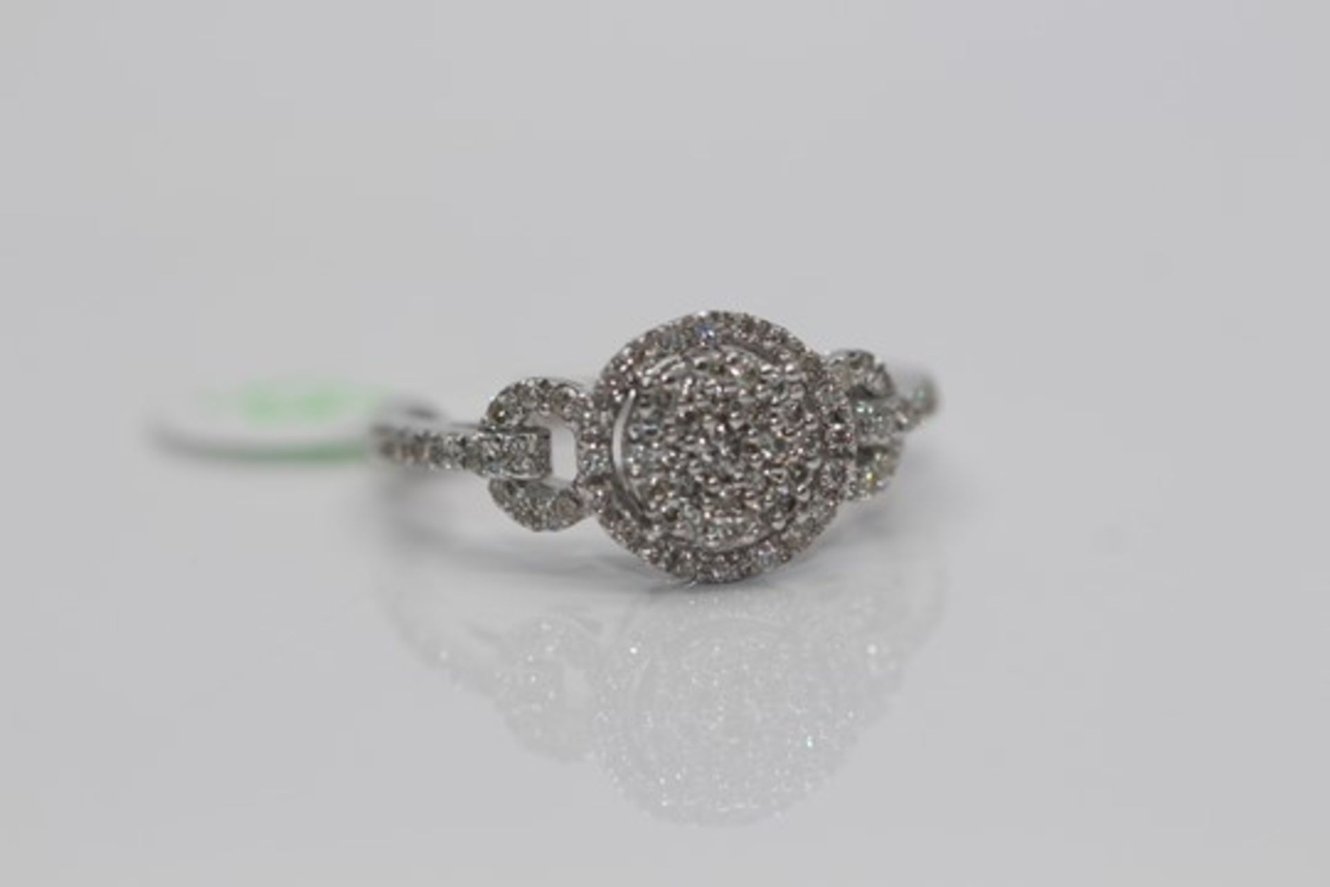 14ct White Gold Diamond Ring, set in a halo setting, with pave set diamonds