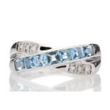 9ct White Gold Blue Topaz And Diamond Ring 0.06 Carats