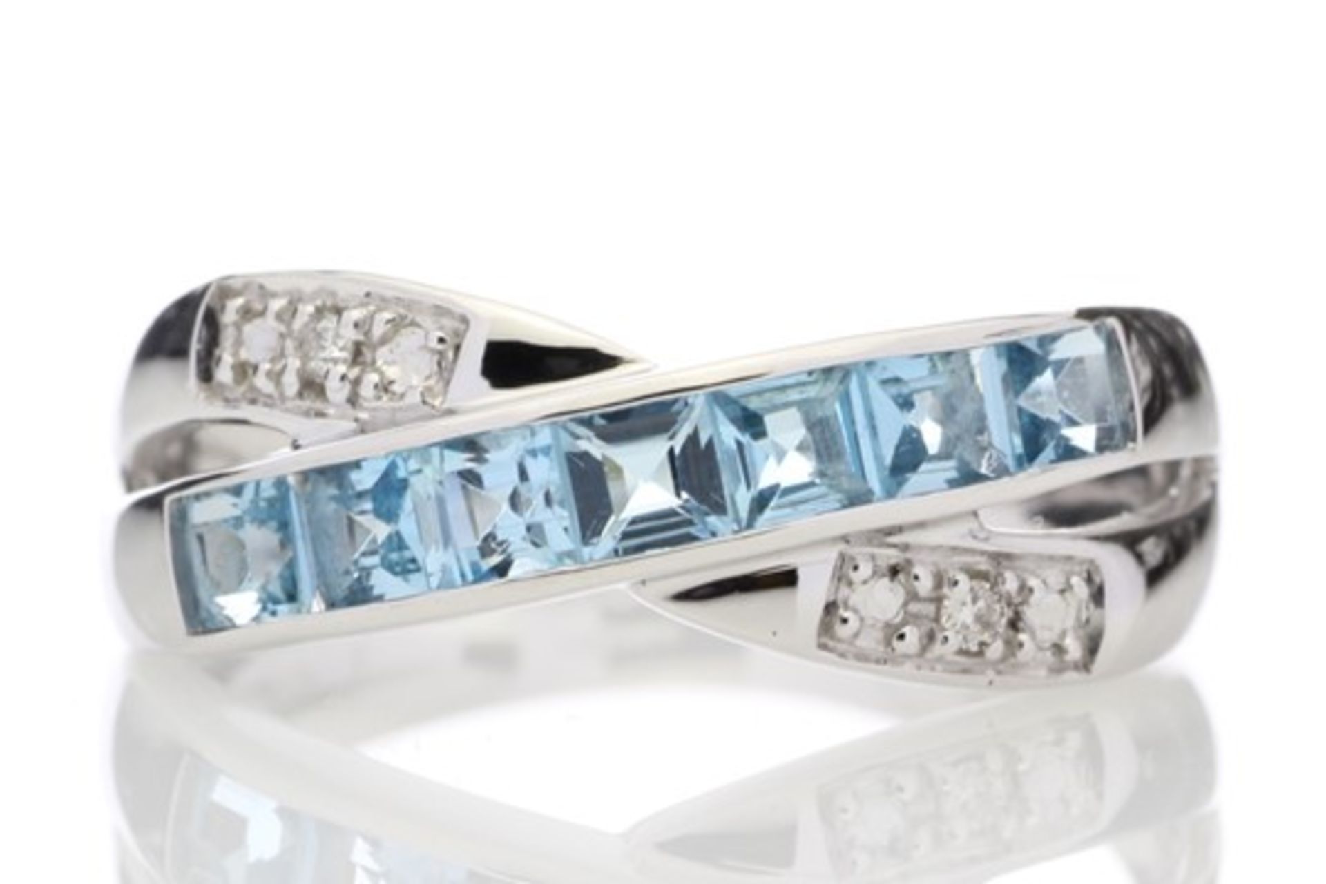 9ct White Gold Blue Topaz And Diamond Ring 0.06 Carats