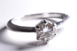 A superb platinum diamond solitaire ring, with a 0.46 carat diamond