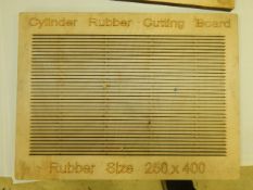 Die board used to cut sheets of rubber into strips
