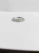 0.60ct diamond band ring set in 14ct white gold. 7 graduated brilliant cut diamonds, I colour and