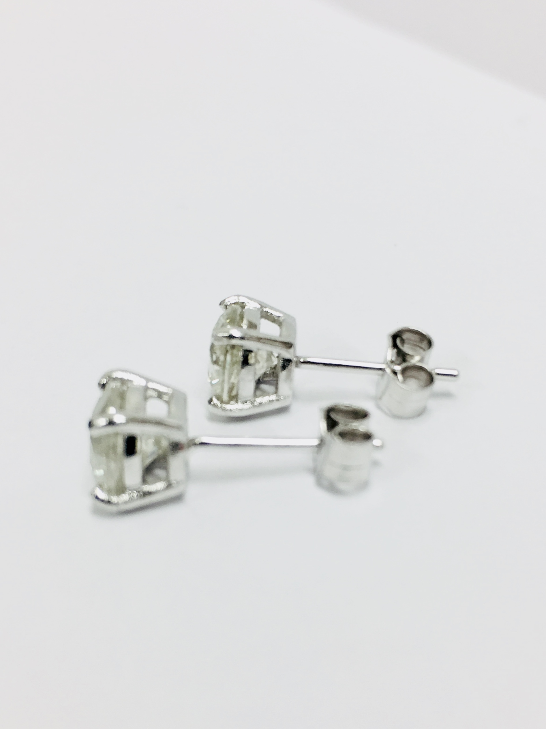 2.00ct Solitaire diamond stud earrings set with brilliant cut diamonds which have been enhanced. I - Image 3 of 3