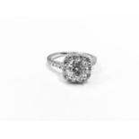 1.25ct diamond halo ring set in 18ct white gold ,1ct natural diamond h colour si2 grade centre ,0.