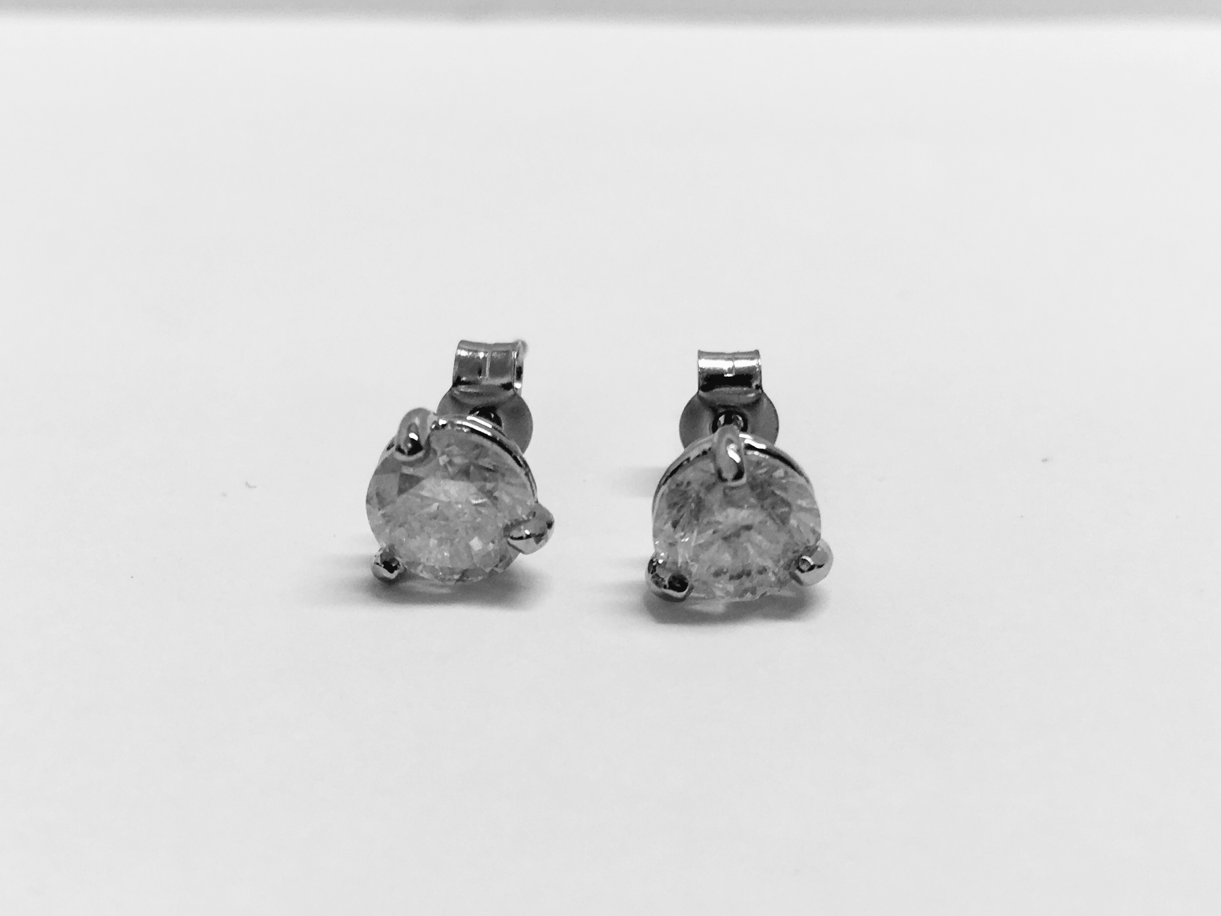 2.00ct Solitaire diamond stud earrings set with brilliant cut diamonds which have been enhanced. I - Image 2 of 4